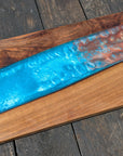 Walnut striking blue and bronze river board