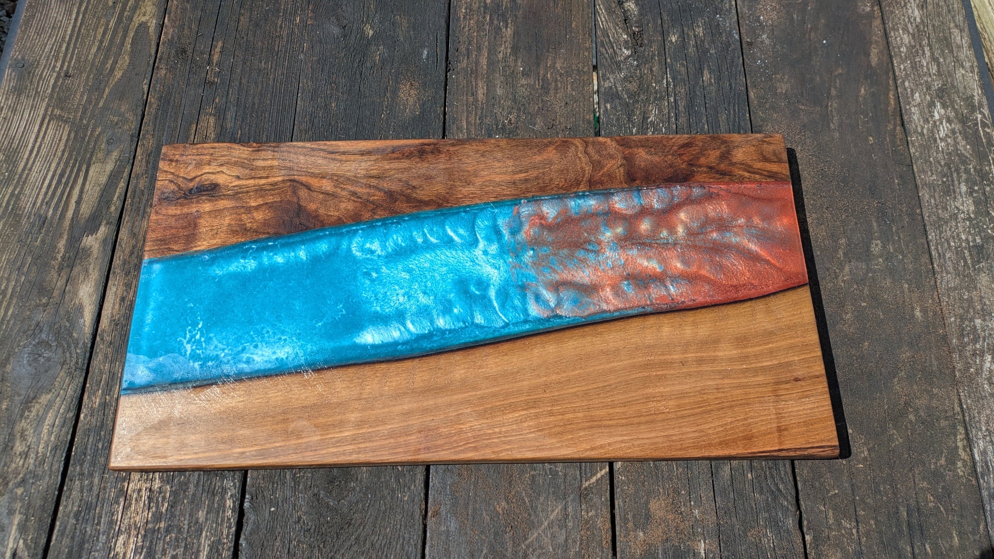 Walnut striking blue and bronze river board
