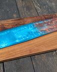Walnut striking blue and bronze river board