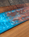 Walnut striking blue and bronze river board