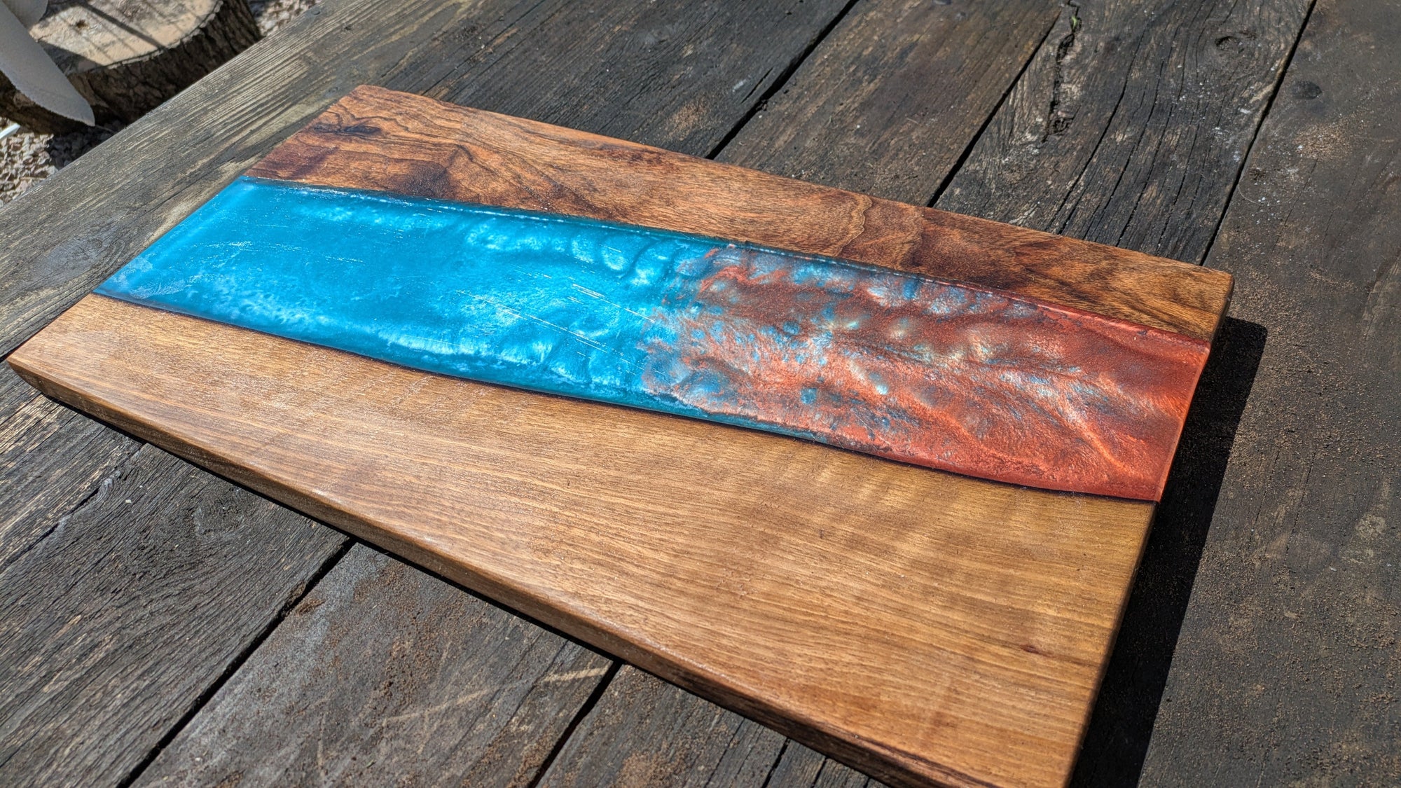 Walnut striking blue and bronze river board