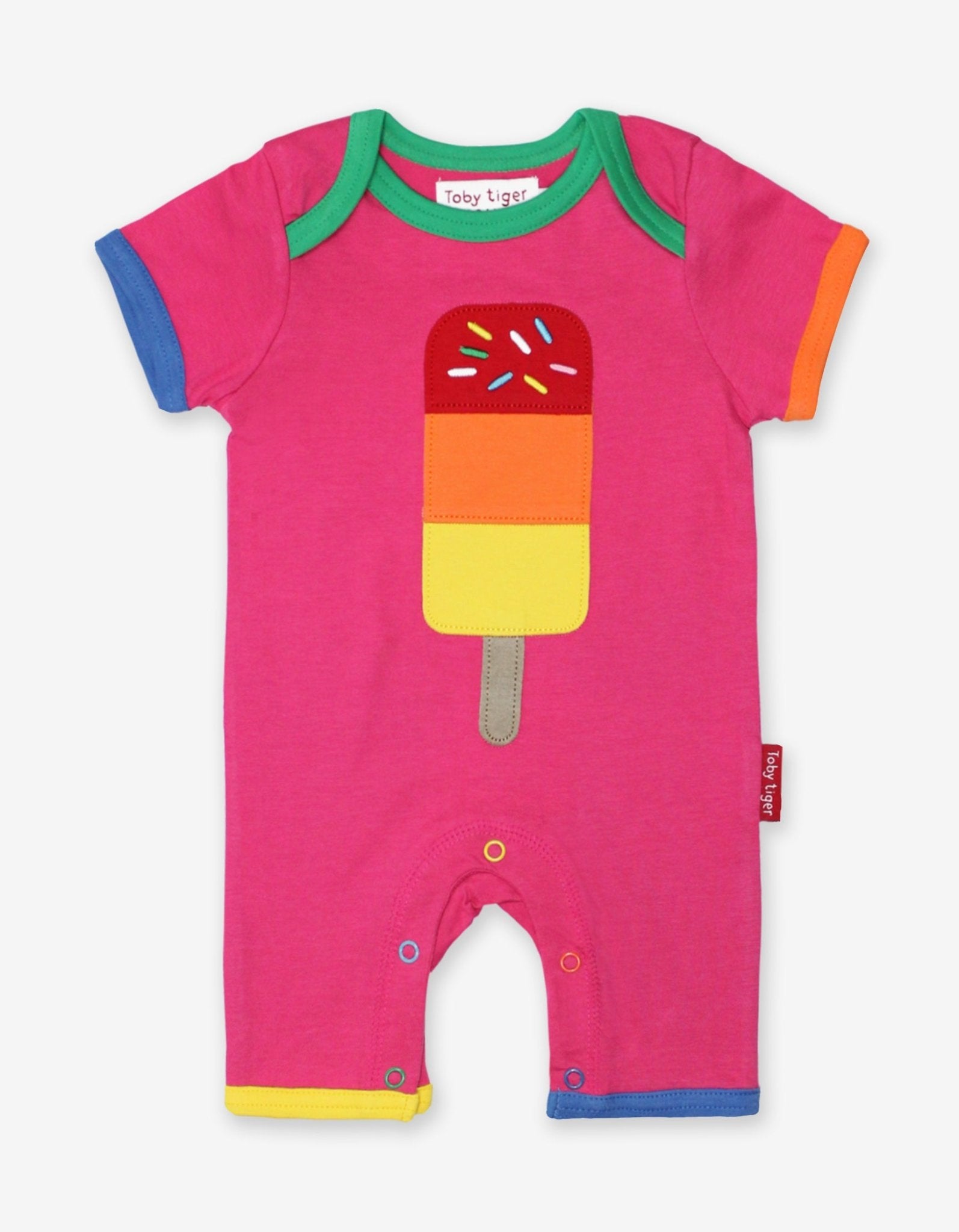 Premium baby summer romper in bold pink with candy applique, short sleeves, snap buttons, soft organic cotton, sustainable dye, machine washable by Toby Tiger at brixbailey.com