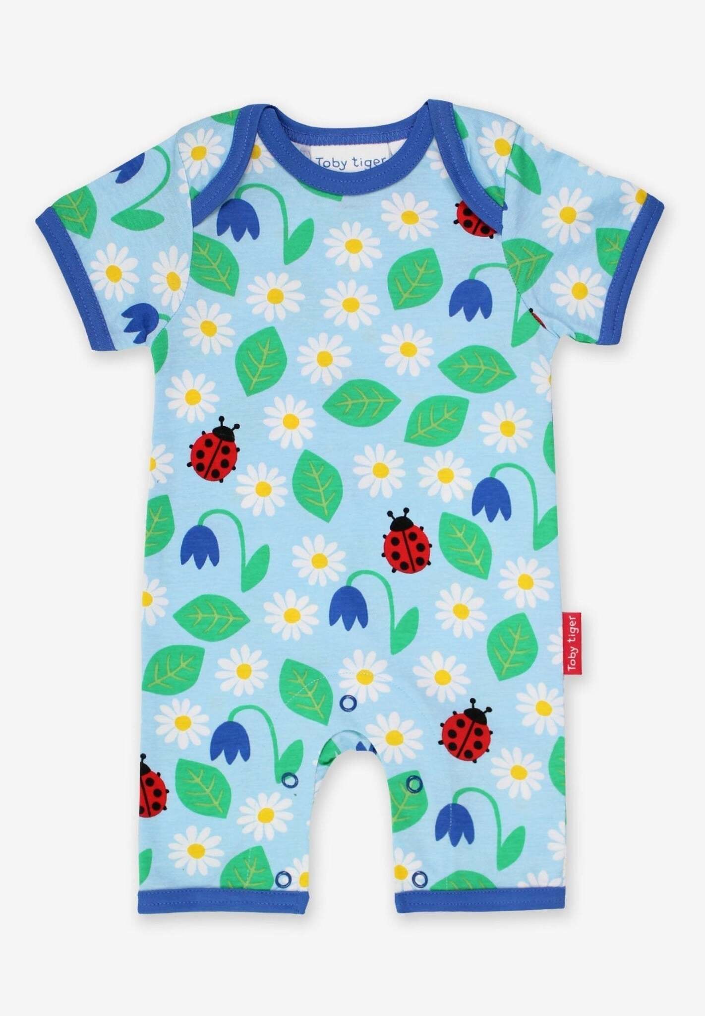 Premium summer baby romper with ladybug print, soft certified organic cotton, short legs, snap buttons, stylish and comfortable by Toby Tiger at brixbailey.com