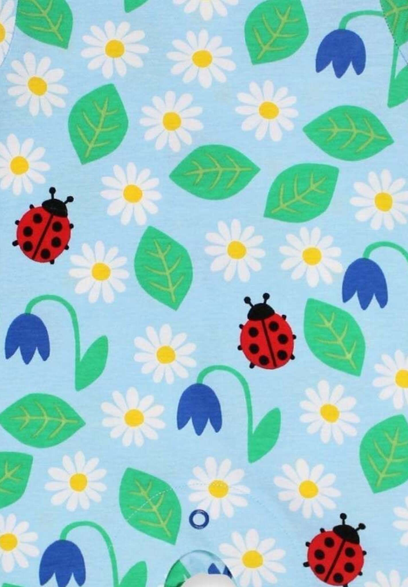 Premium baby summer romper with ladybug print in soft blue, certified organic cotton, short legs, snap buttons, breathable by Toby Tiger at brixbailey.com