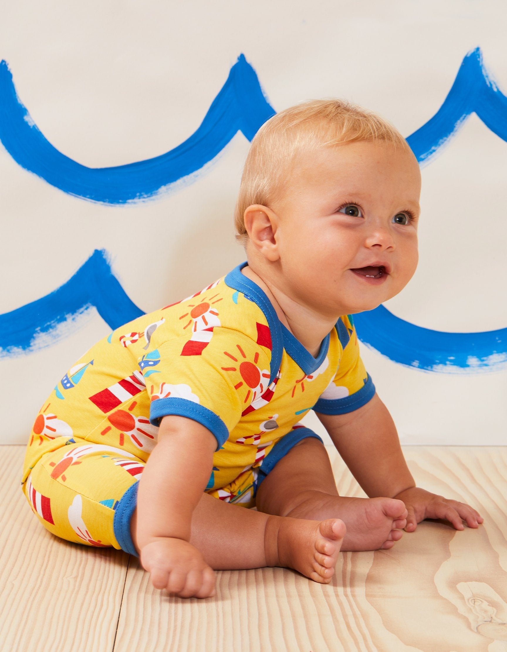 Charming Yellow Summer Romper for Baby’s First Beach Vacation, Soft Organic Cotton with Nautical Print and Snap Buttons by Toby Tiger at brixbailey.com