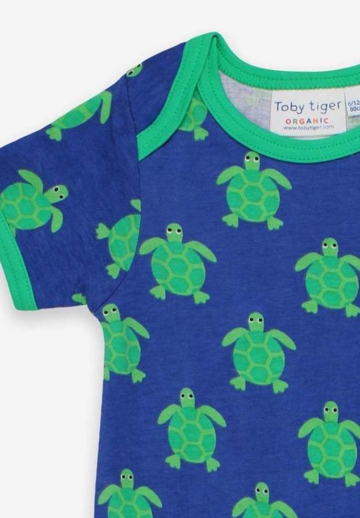 Premium baby romper with short legs, cute turtle print, snap buttons, soft organic cotton, sustainable summer outfit by Toby Tiger at brixbailey.com