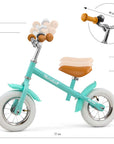 a young child riding the marshall balance bike on a sunny path, 10-inch air tires and soft grips for a smooth adventure