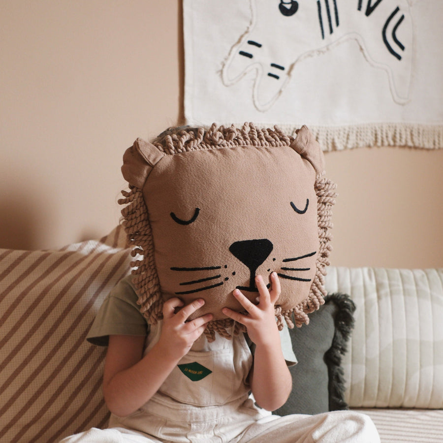 Premium Nobodinoz lion cushion with sleepy face embroidery and curly fringe, soft plush toy for kids by Ella James at brixbailey.com