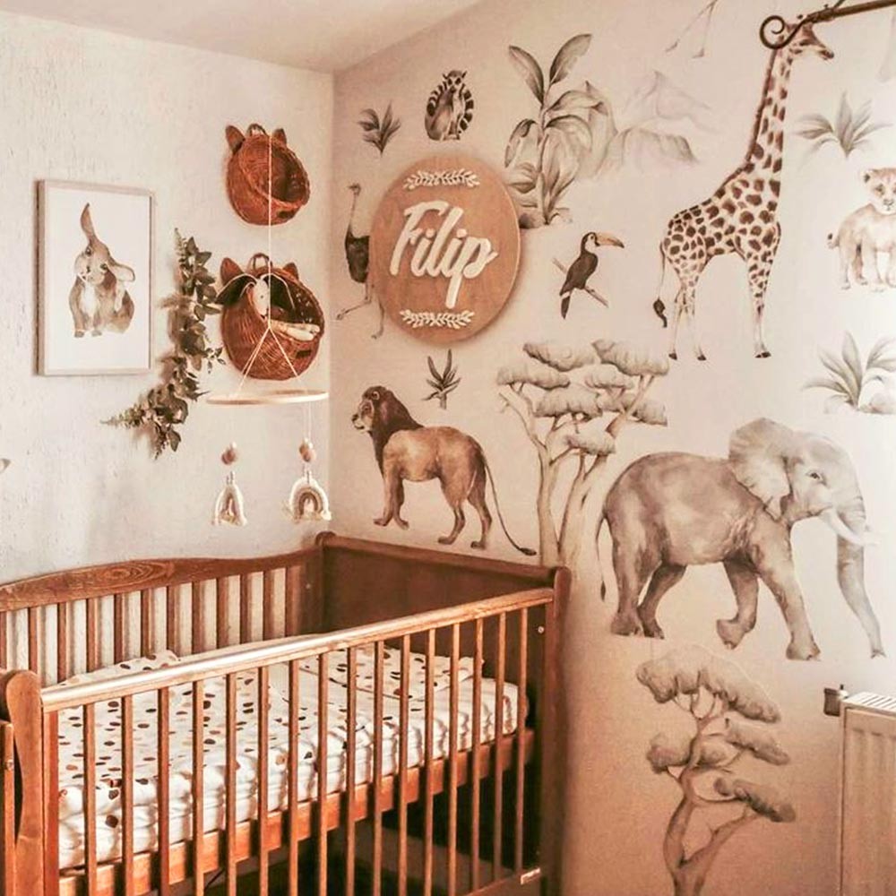 a gentle close-up of the savanna wall sticker set featuring a lion dad and cub in soft pastel colors