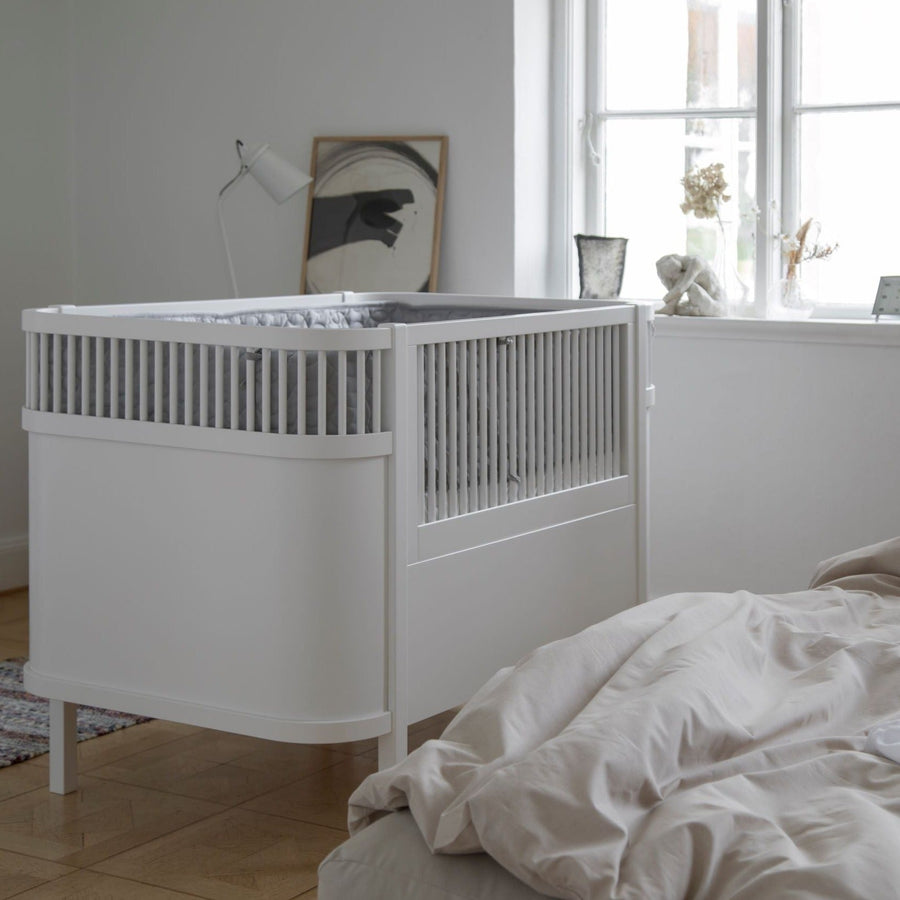 Luxury Sebra white baby and junior cot bed, premium beech wood, adjustable height, non-toxic paint, best-selling by Ella James at brixbailey.com