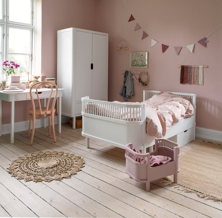 Luxury white Sebra baby and junior cot bed, premium beech wood, adjustable height, non-toxic paint, best-selling convertible crib by Ella James at brixbailey.com