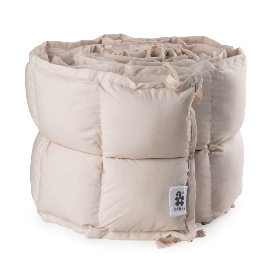 Premium organic cotton kapok bumper in birchbark rose, soft hypoallergenic breathable baby crib bedding for 0-6 months, fits standard 60x120cm beds by Ella James at brixbailey.com