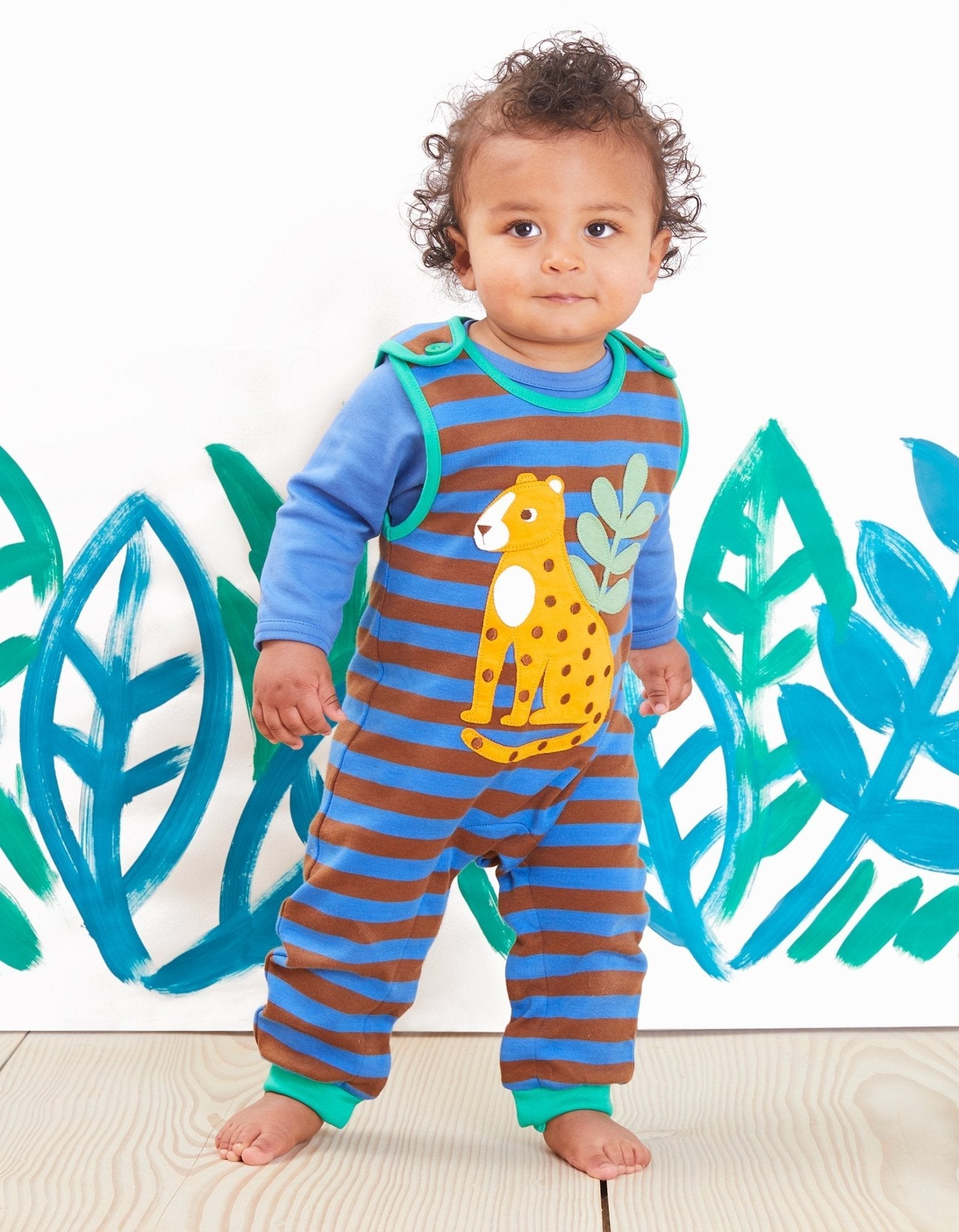 Stylish Leopard Print Organic Cotton Baby Bodysuit with Snap Buttons for Easy Dressing by Toby Tiger at brixbailey.com