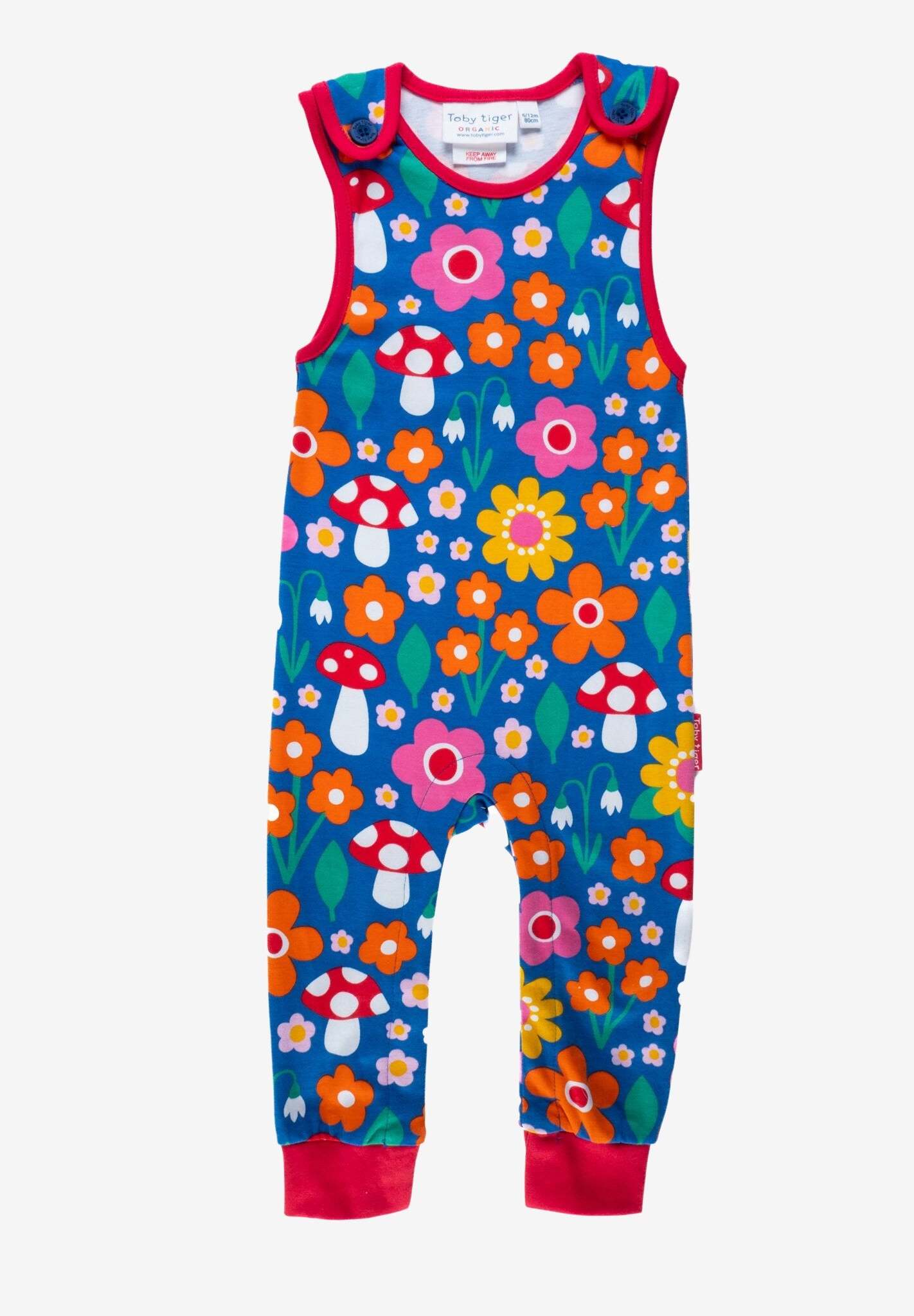 Premium organic cotton baby overalls with floral mushroom print, soft GOTS-certified fabric, snap-button legs, stylish red ankle bands by Toby Tiger at brixbailey.com