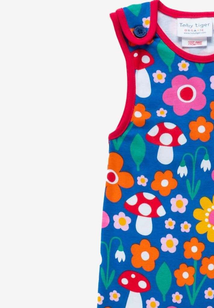 Premium organic cotton baby overall with floral mushroom print, soft red ankle bands, snap buttons, GOTS certified eco-friendly by Toby Tiger at brixbailey.com