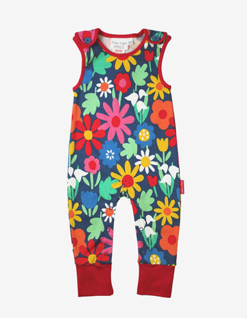 Premium organic cotton baby overalls with vibrant floral print, stylish romper, soft GOTS-certified fabric, eco-friendly dyes, snap buttons by Toby Tiger at brixbailey.com