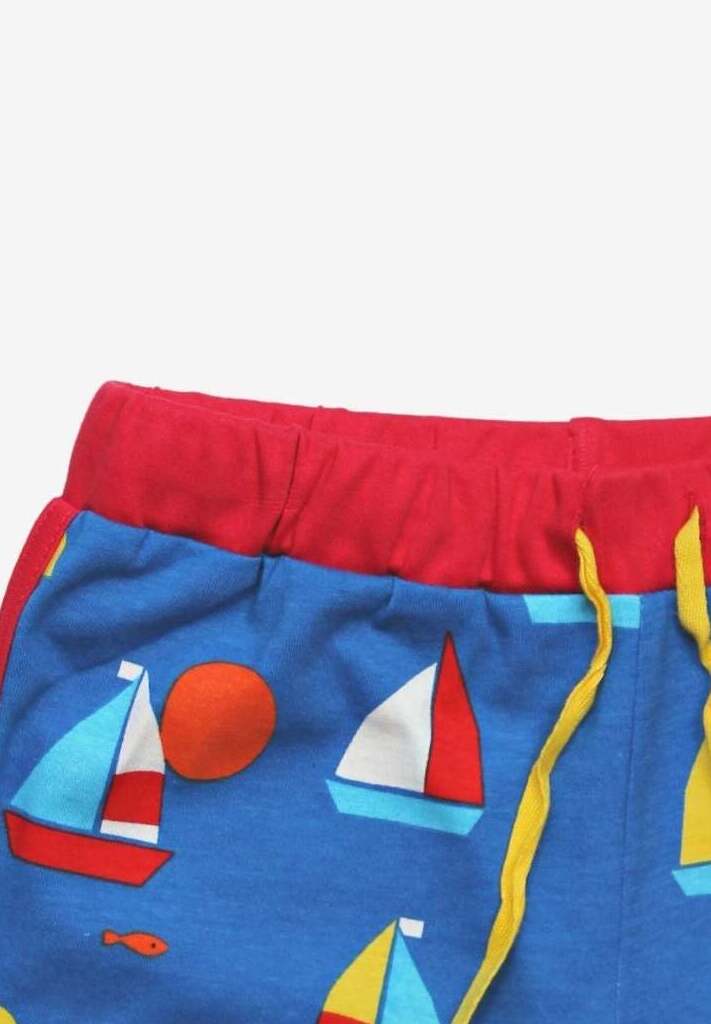 Luxury organic sailboat print shorts, premium soft 100% GOTS certified cotton, stylish red trim, adjustable yellow drawstring by Toby Tiger at brixbailey.com