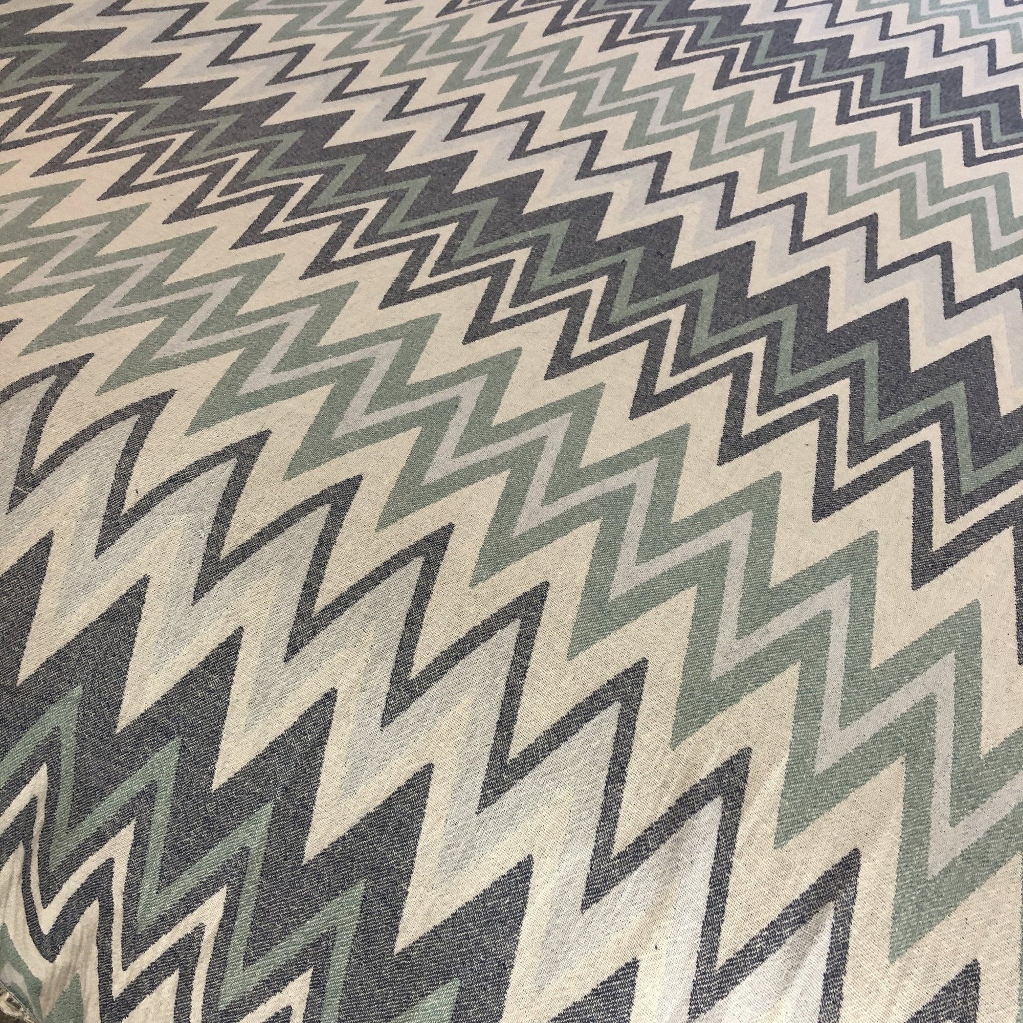 Sirocco organic cotton jacquard weave throw, oversized luxury blanket in muted greens blues greys, stylish zigzag pattern, premium soft bedspread or sofa cover by Wildash London at brixbailey.com