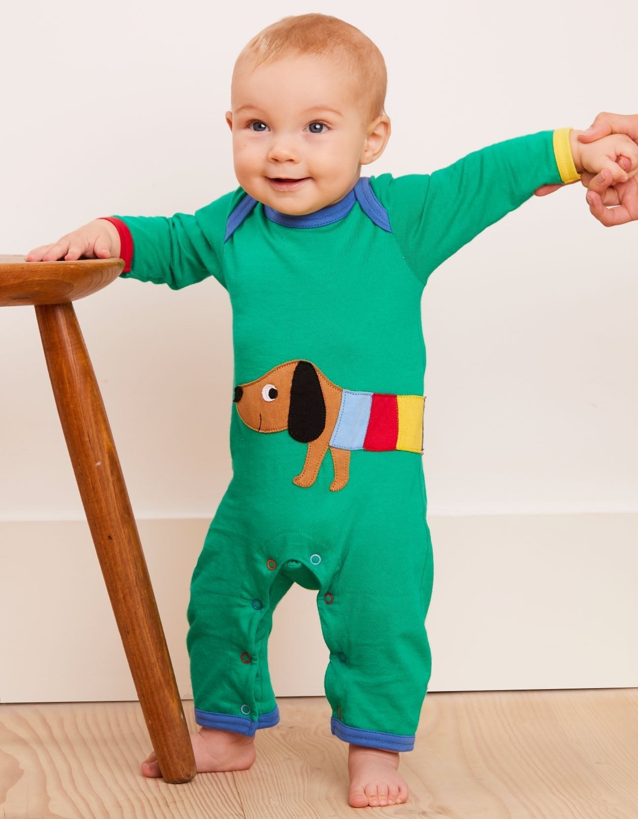 Premium green organic cotton baby sleep romper with dog applique, GOTS certified, snap button closure, soft and comfortable by Toby Tiger at brixbailey.com