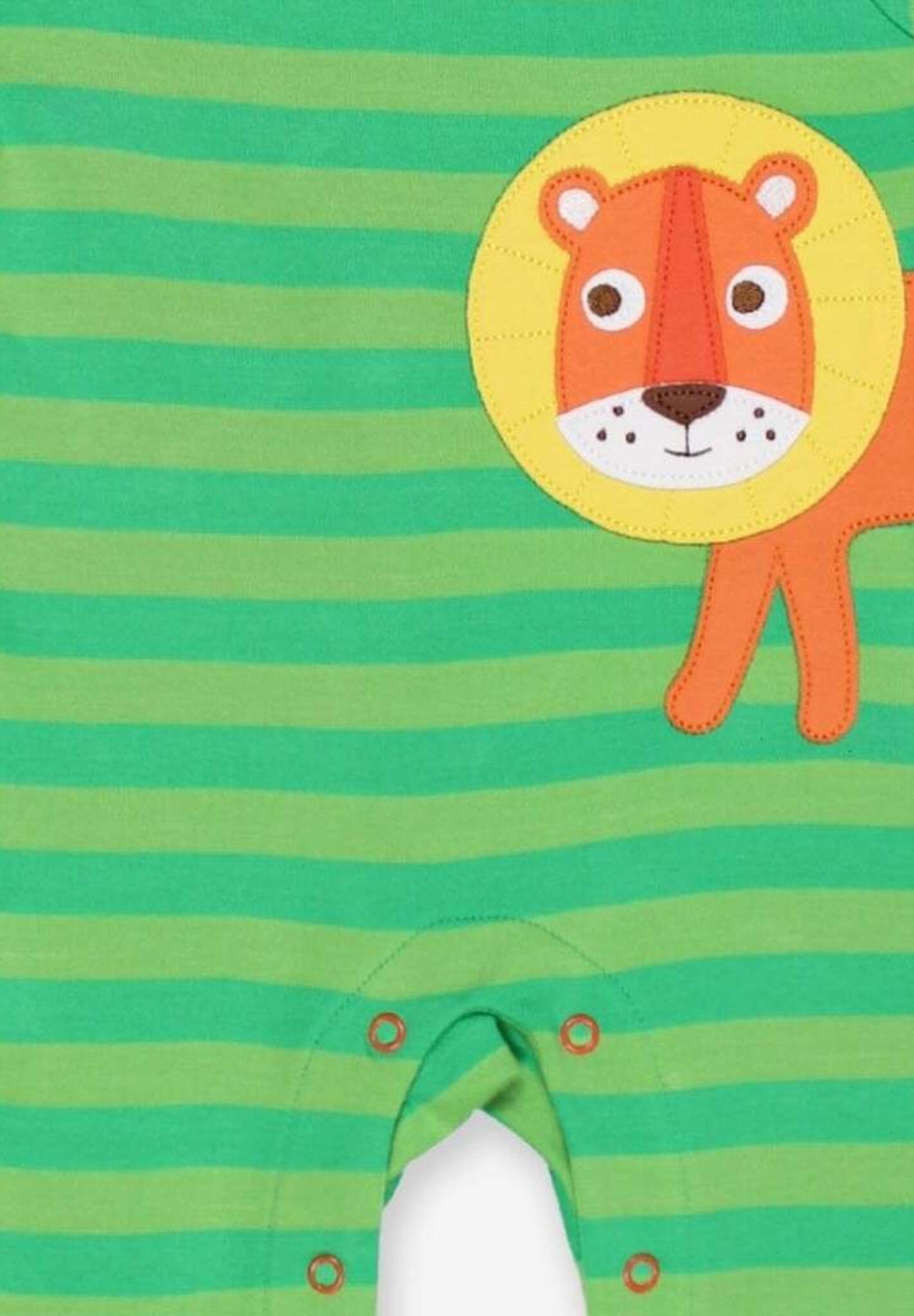 Premium organic cotton baby sleep suit with lion applique, soft GOTS certified fabric, eco-friendly dyes, snap buttons, Toby Tiger design by Toby Tiger at brixbailey.com