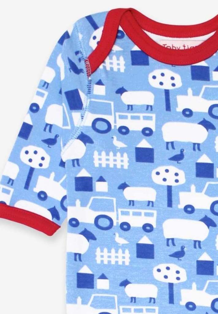 Premium baby sleepwear, organic cotton farm print pajamas, soft GOTS-certified fabric, stylish Toby Tiger design, easy snap closure by Toby Tiger at brixbailey.com