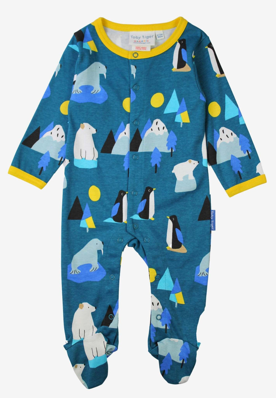 Premium baby sleepsuit with Arctic animal print, soft organic cotton pajamas, cozy blue penguin walrus polar bear design, GOTS certified by Toby Tiger at brixbailey.com