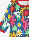 Premium Dark Blue Floral One-Piece with Snowdrops Daisies and Tulips - Soft Organic Cotton Baby Romper with Snap Buttons by Toby Tiger at brixbailey.com