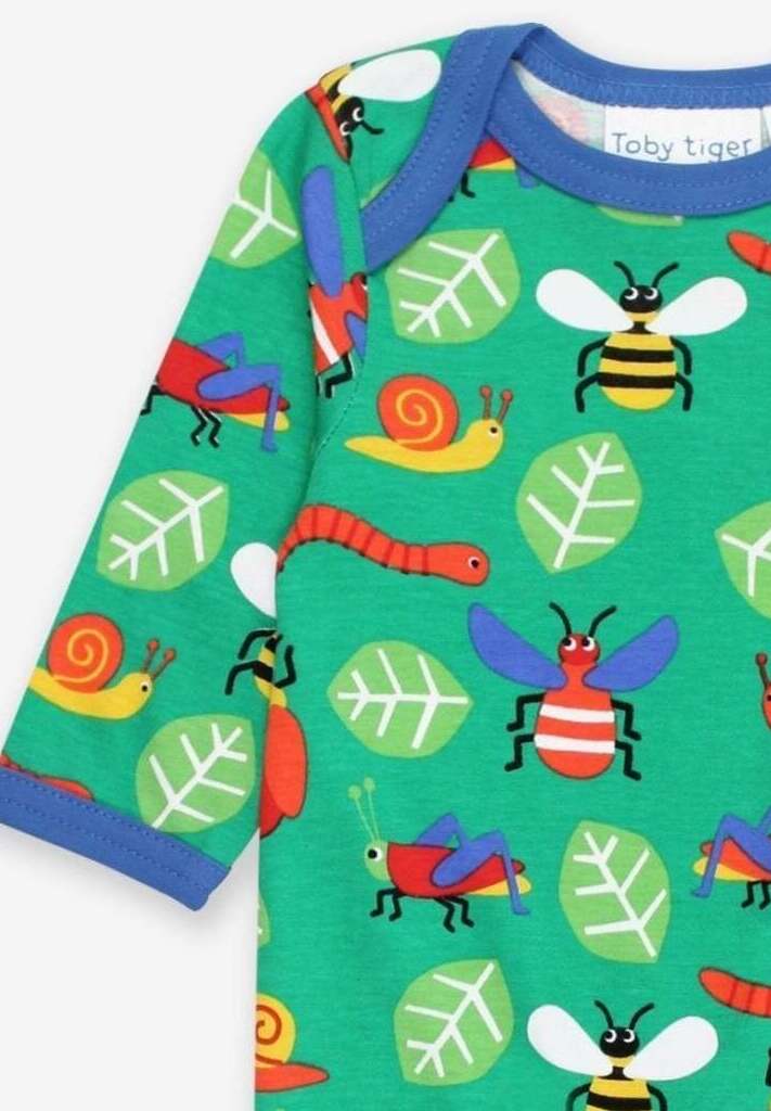 Premium baby sleepwear, organic cotton insect print pajamas, soft GOTS-certified, blue trim, snap buttons, machine washable by Toby Tiger at brixbailey.com