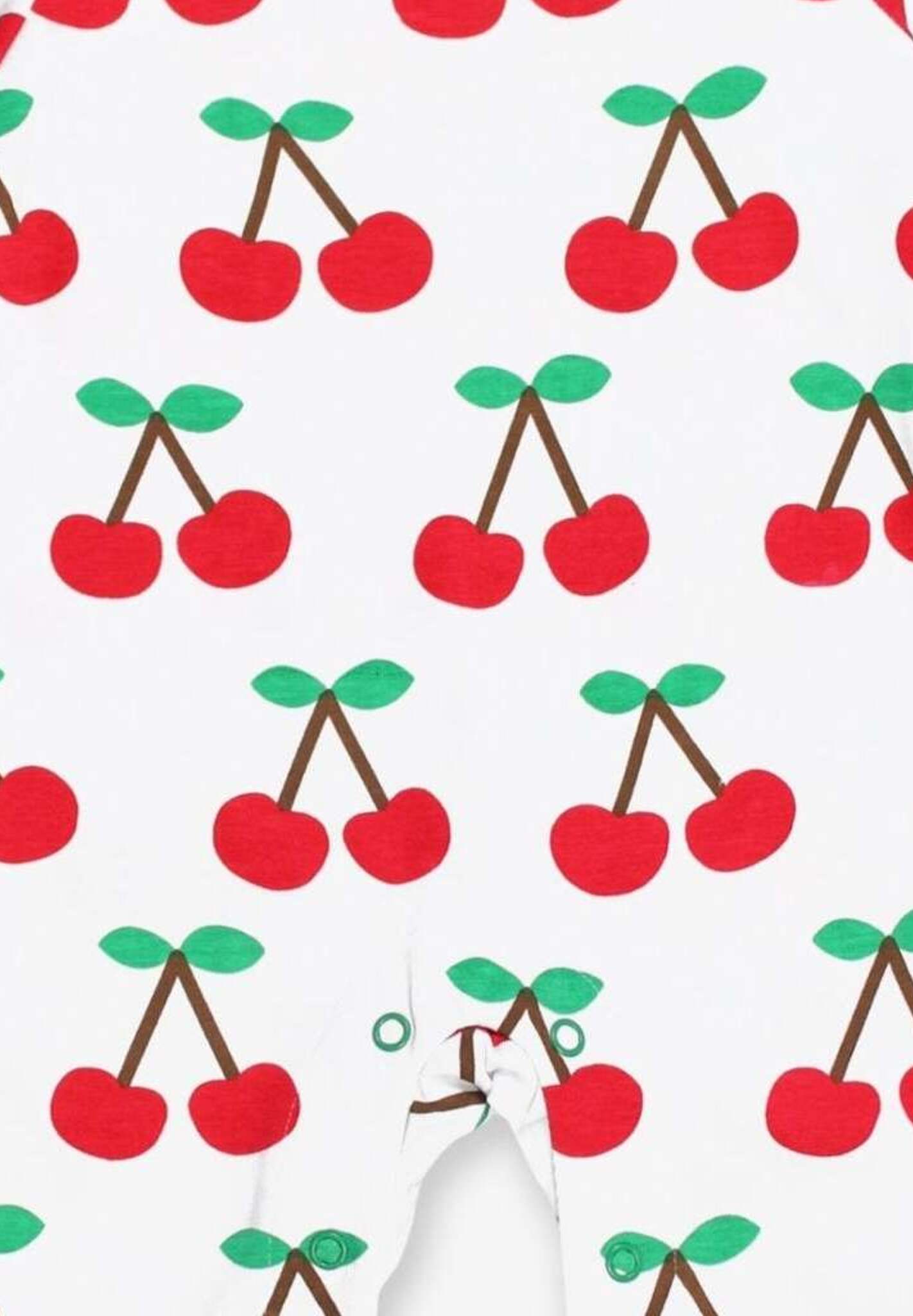 Premium organic cotton pajamas with cherry print, stylish red trim, slip-on neckline, snap buttons, soft GOTS-certified fabric by Toby Tiger at brixbailey.com