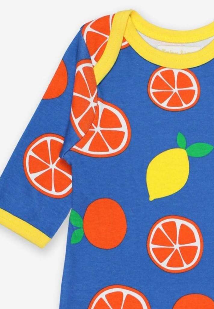 Premium organic cotton pajama set with citrus print, soft GOTS-certified fabric, slip-on design with snap buttons, stylish Toby Tiger pattern by Toby Tiger at brixbailey.com