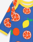 Premium organic cotton pajama set with citrus print, soft GOTS-certified fabric, slip-on design with snap buttons, stylish Toby Tiger pattern by Toby Tiger at brixbailey.com