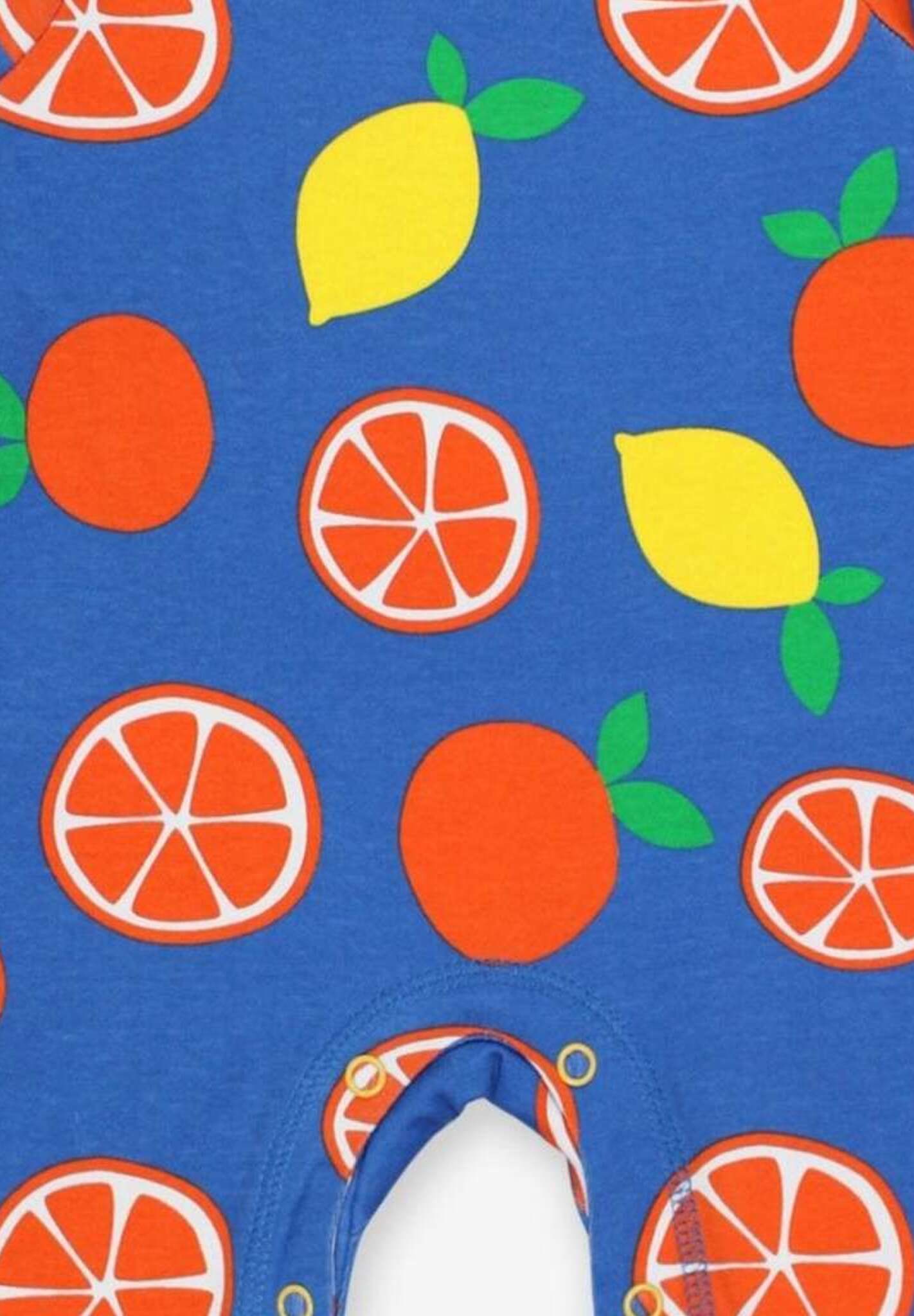 Premium organic cotton pajama set with citrus print, stylish sleepwear with slip-on neckline and snap buttons, soft GOTS-certified fabric by Toby Tiger at brixbailey.com
