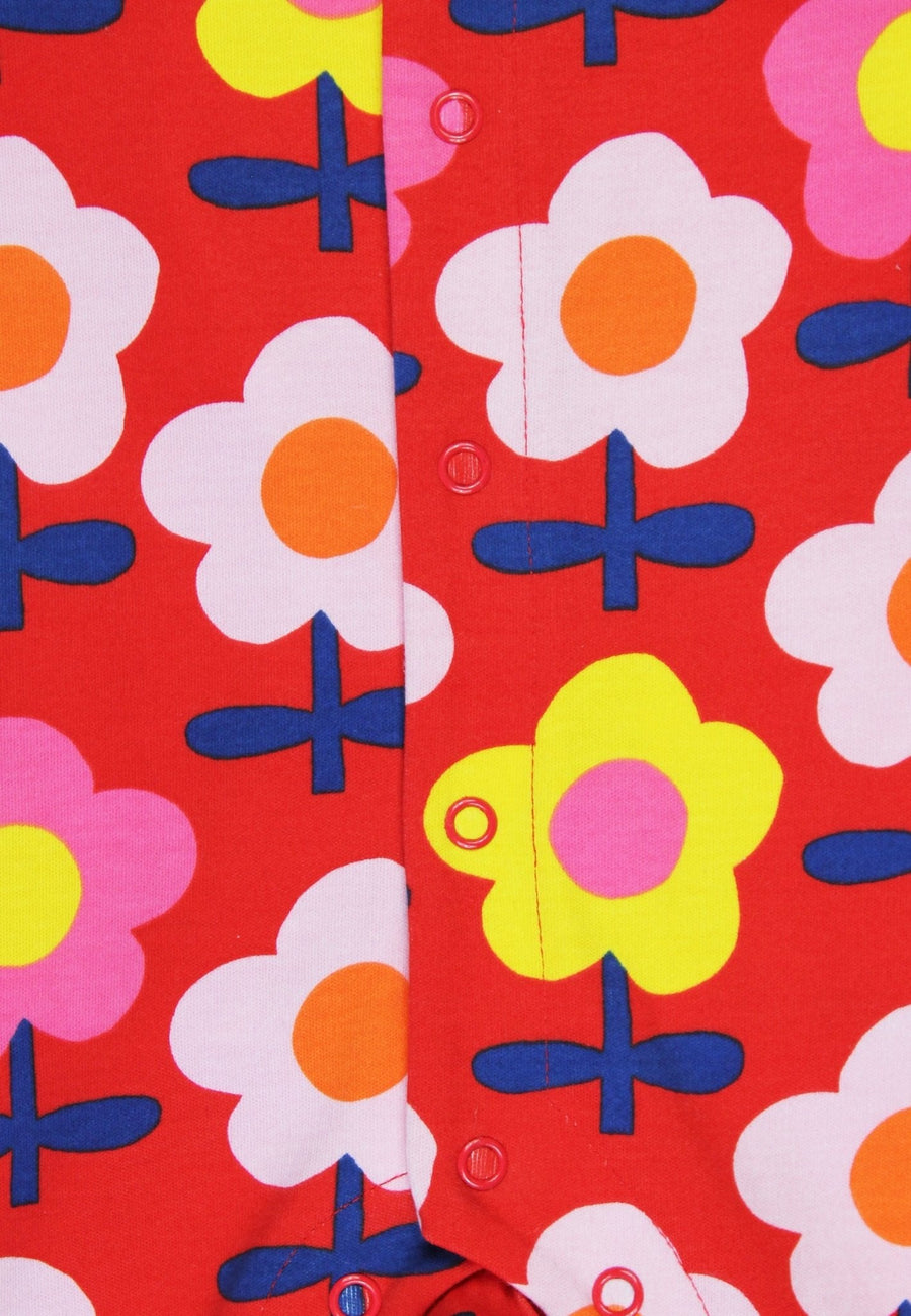 Premium organic cotton baby romper with retro floral print, soft GOTS certified sleepwear, stylish and comfortable for day or night by Toby Tiger at brixbailey.com