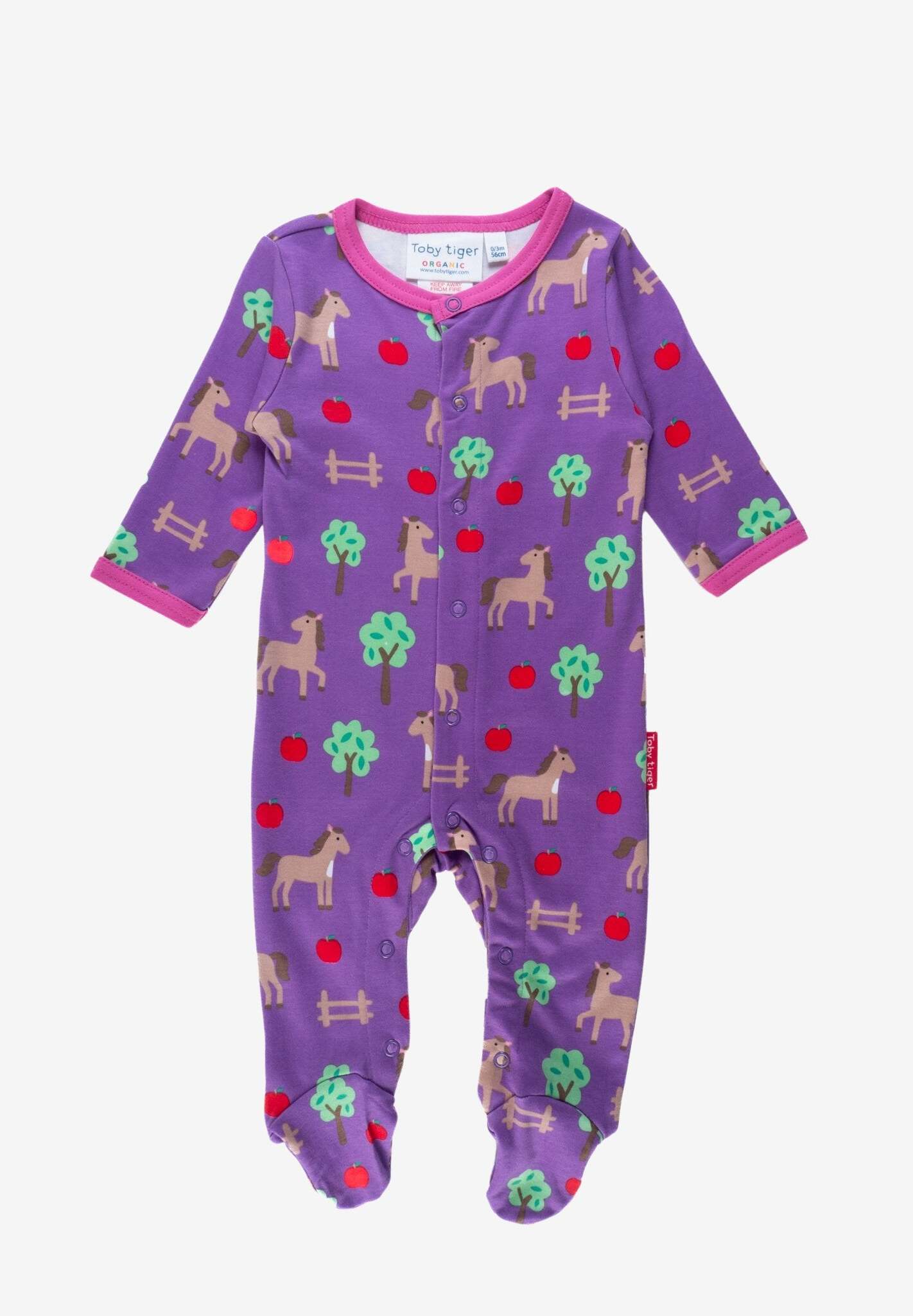 Premium organic cotton baby sleep suit with cozy horse and apple design, closed feet for warmth, GOTS certified by Toby Tiger at brixbailey.com