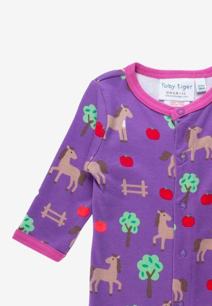 Premium organic cotton baby sleepwear with horse and apple design, soft cozy pajamas for boys and girls, GOTS certified eco-friendly by Toby Tiger at brixbailey.com