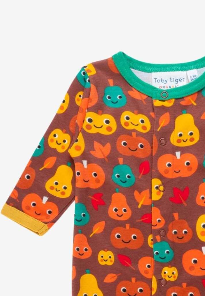Premium baby pumpkin print organic cotton footed pajamas, cozy autumn sleepwear with snap buttons, GOTS certified by Toby Tiger at brixbailey.com