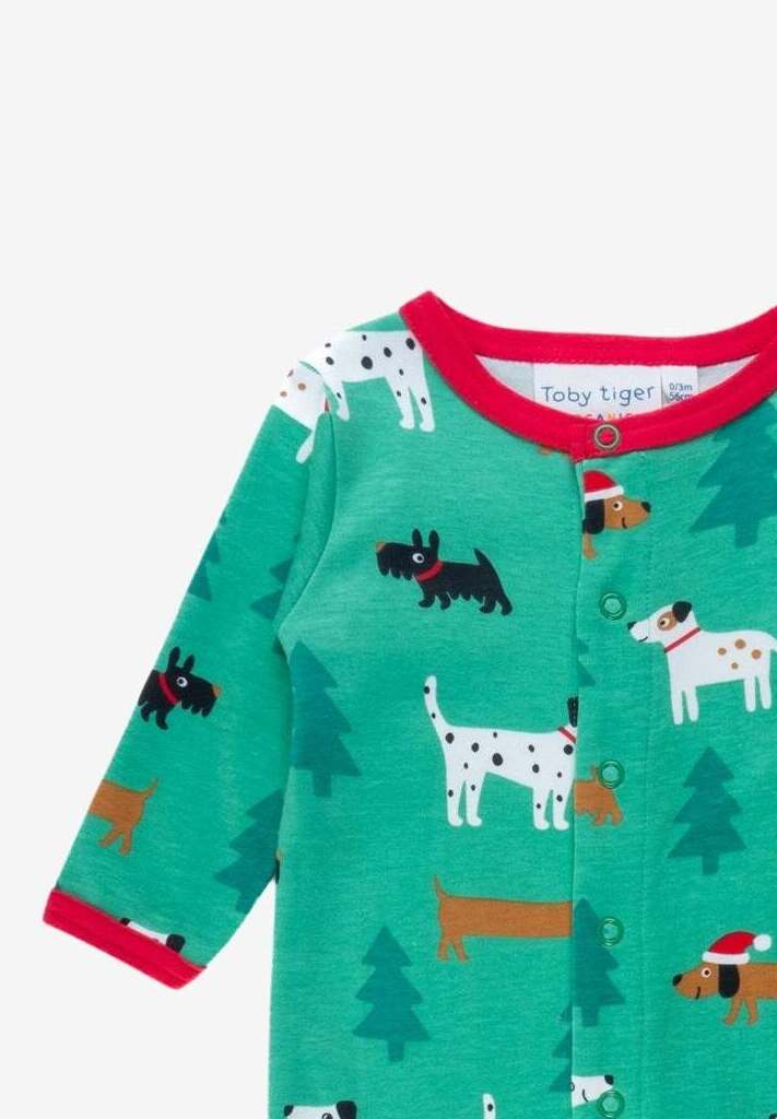 Premium organic Christmas dog baby bodysuit with footies, soft GOTS-certified cotton, snap buttons, cozy holiday pajamas by Toby Tiger at brixbailey.com