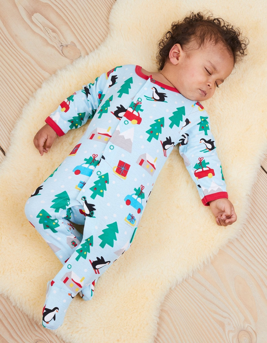 Premium GOTS Certified Organic Cotton Baby Christmas Pajamas with Penguin and Snowman Print, Easy Snap Closure, Cozy Footed Design by Toby Tiger at brixbailey.com