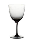 four smoky crystal wine glasses with stars design