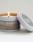 Luxury Solidarity soy candle with lilac buds, green leaves, cool earth fragrance, handcrafted premium glass vessel by Labyrinth Made Goods at brixbailey.com