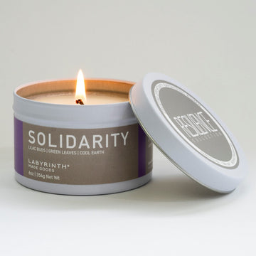 Luxury Solidarity soy candle with lilac buds, green leaves, cool earth fragrance, handcrafted premium glass vessel by Labyrinth Made Goods at brixbailey.com