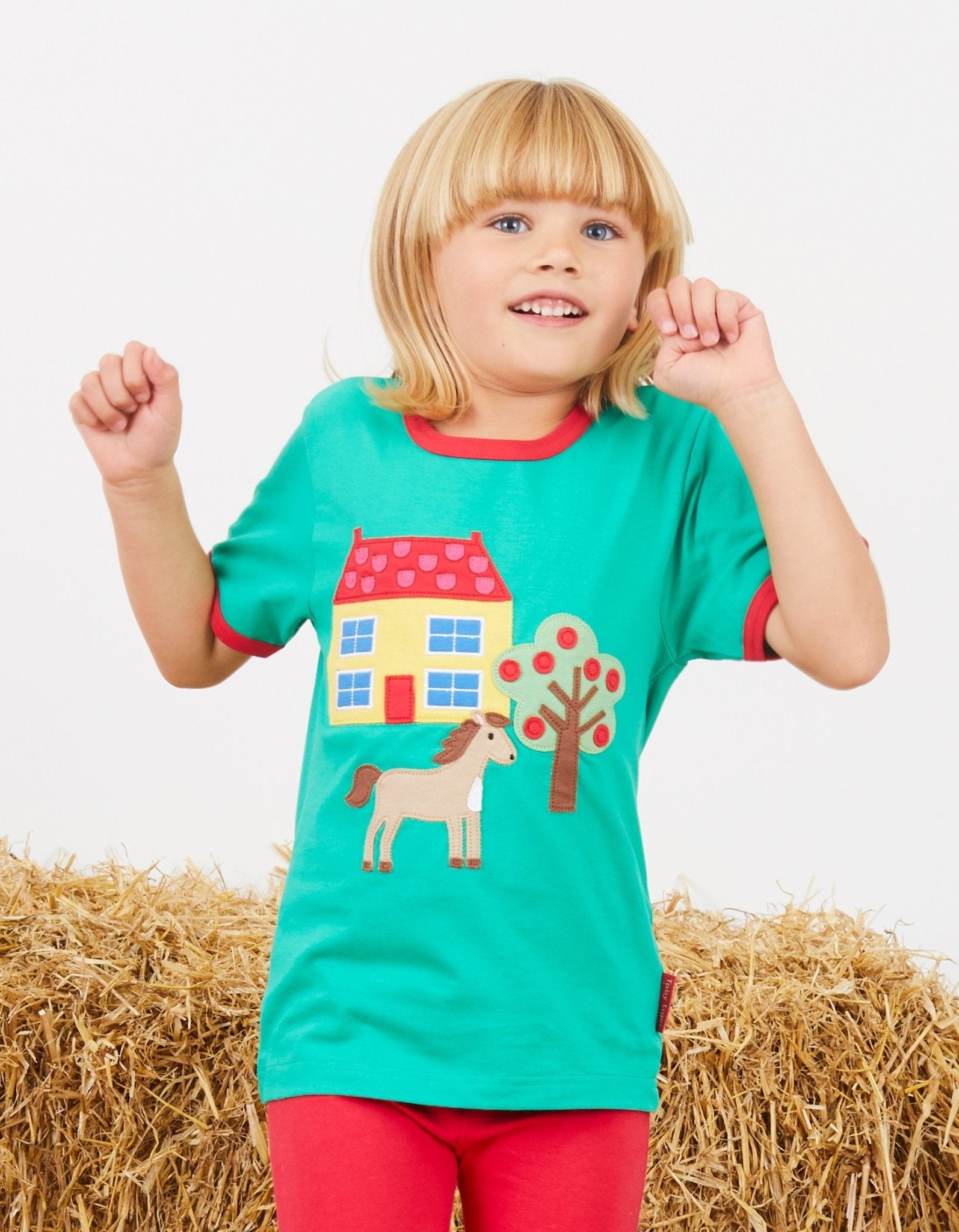 Premium Green Organic Cotton T-Shirt with Farmhouse Applique, Red Trim, and Snap Buttons for Easy Dressing by Toby Tiger at brixbailey.com