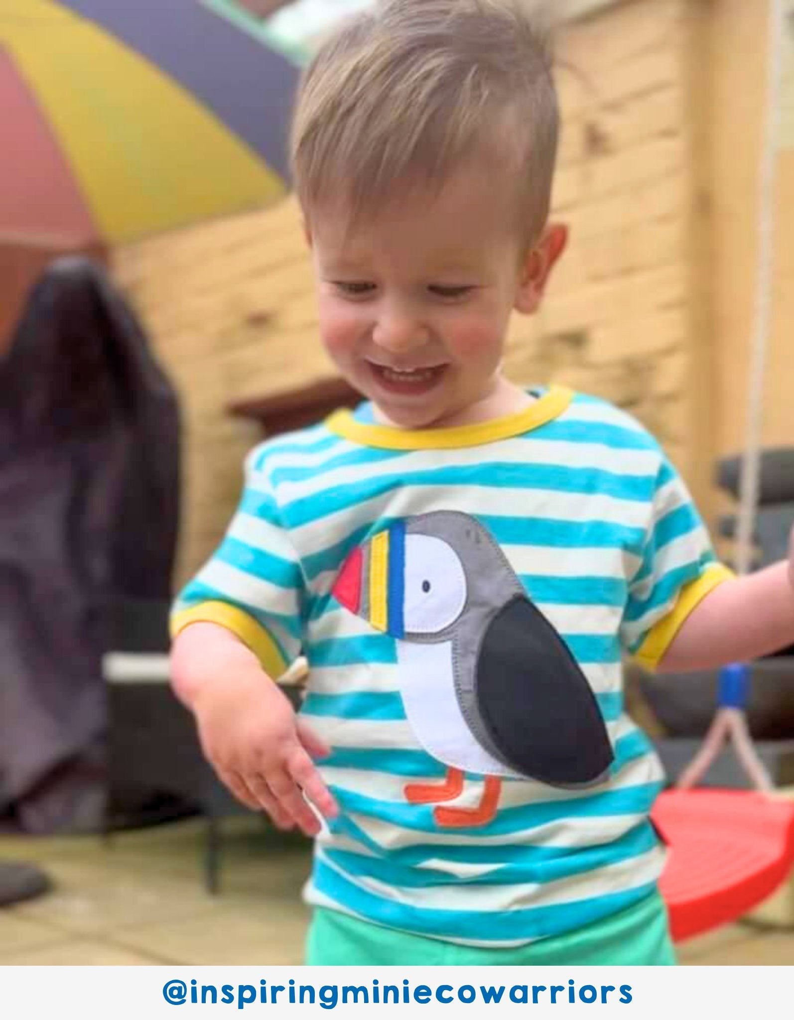 Premium organic cotton baby t-shirt with playful puffin applique, blue and white stripes, hidden fish surprise, soft GOTS-certified fabric by Toby Tiger at brixbailey.com