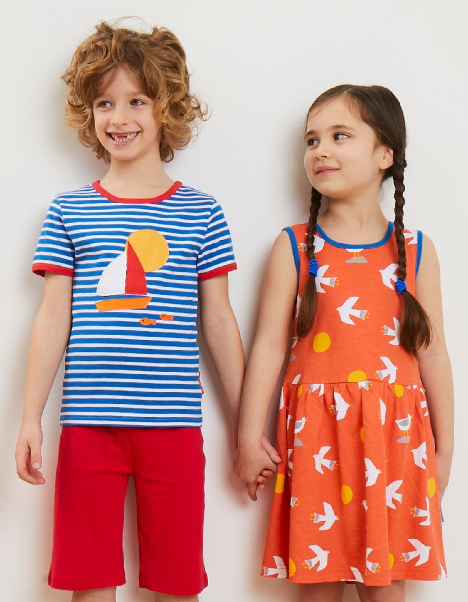 Stylish Blue and White Striped Organic Kids T-Shirt with Sailboat Applique and Red Trim by Toby Tiger at brixbailey.com
