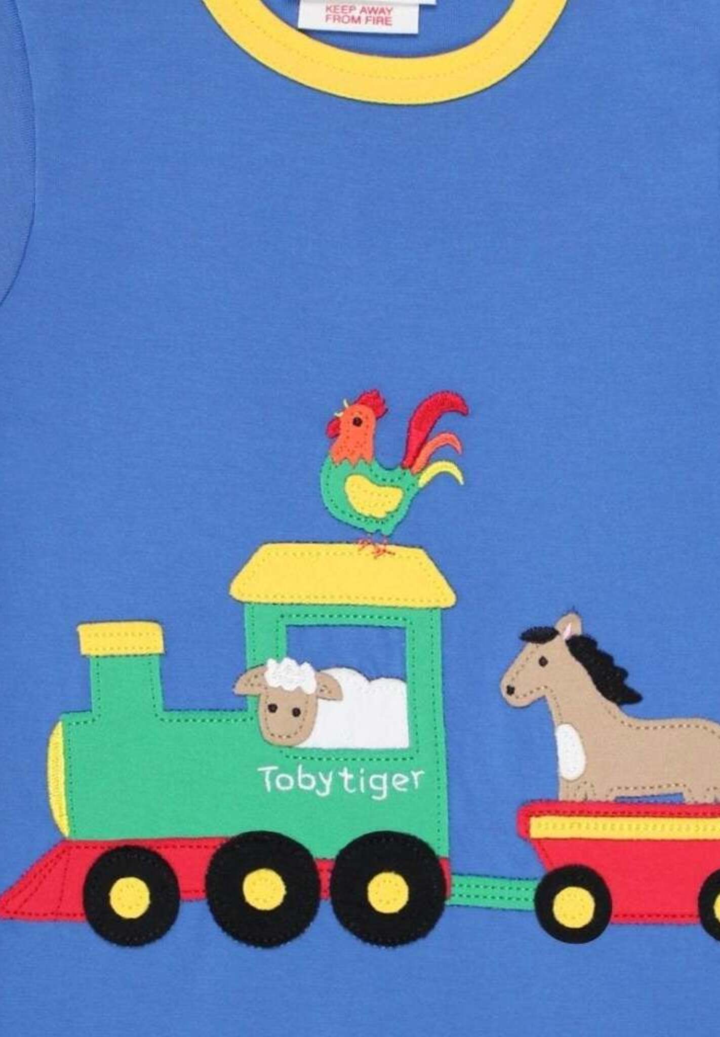 Premium organic cotton kids t-shirt with playful train applique, soft GOTS-certified fabric, snap buttons for easy dressing by Toby Tiger at brixbailey.com