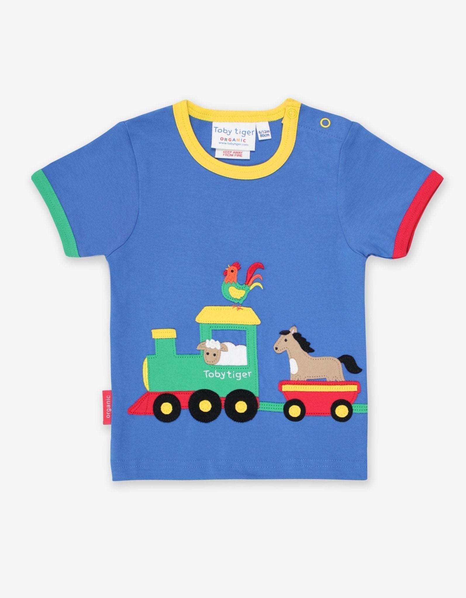 Premium organic cotton baby t-shirt with playful train applique, soft GOTS-certified fabric, snap buttons for easy dressing, eco-friendly dyes by Toby Tiger at brixbailey.com