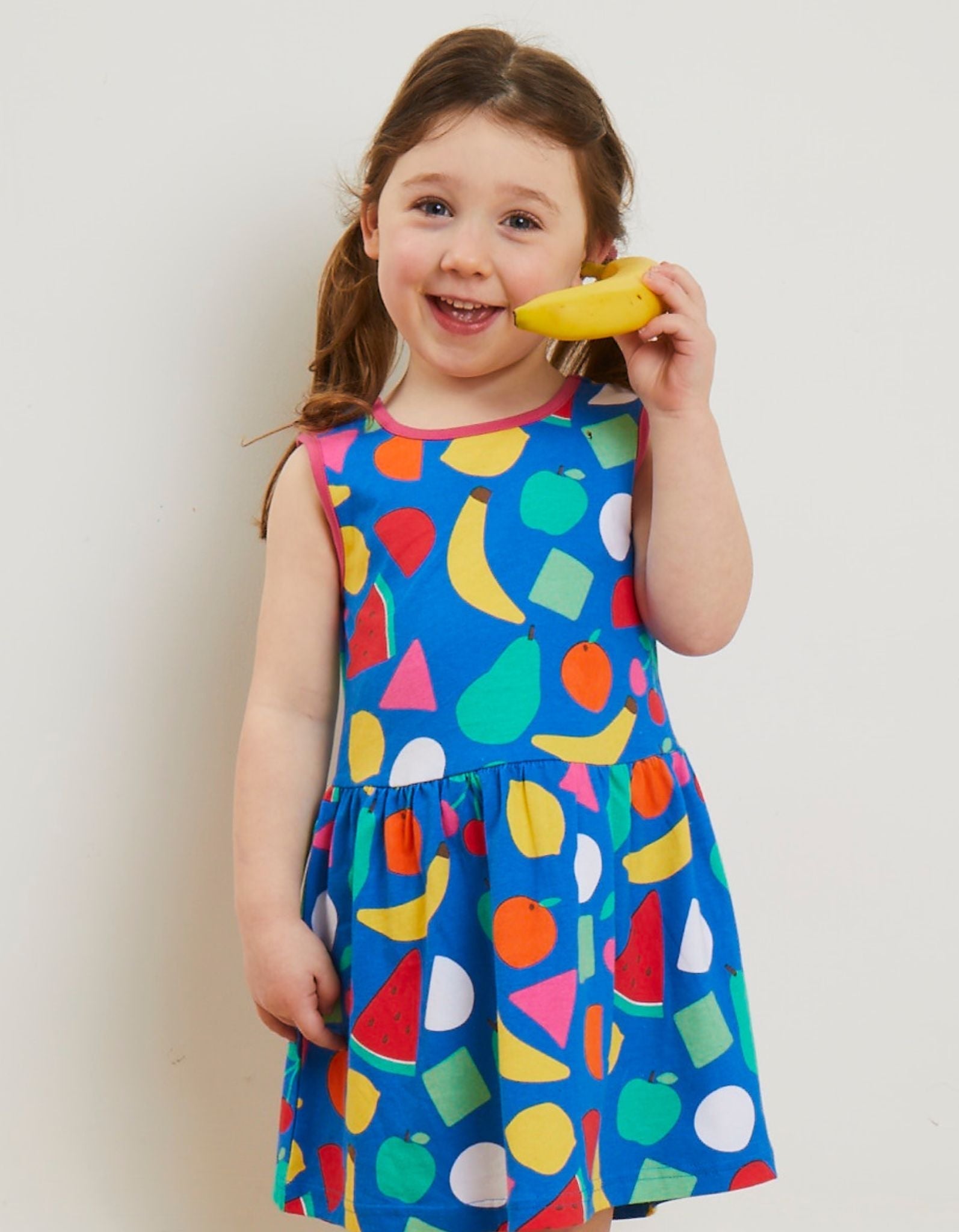 Organic Cotton Kids Summer Dress with Vibrant Fruit Print - Watermelon, Banana, Lemon, Apples, and Pears - Toby Tiger Design by Toby Tiger at brixbailey.com