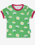 Premium baby daisy print organic cotton shirt, soft GOTS certified short sleeve tee with snap buttons, pink trim, sizes 3-24 months by Toby Tiger at brixbailey.com