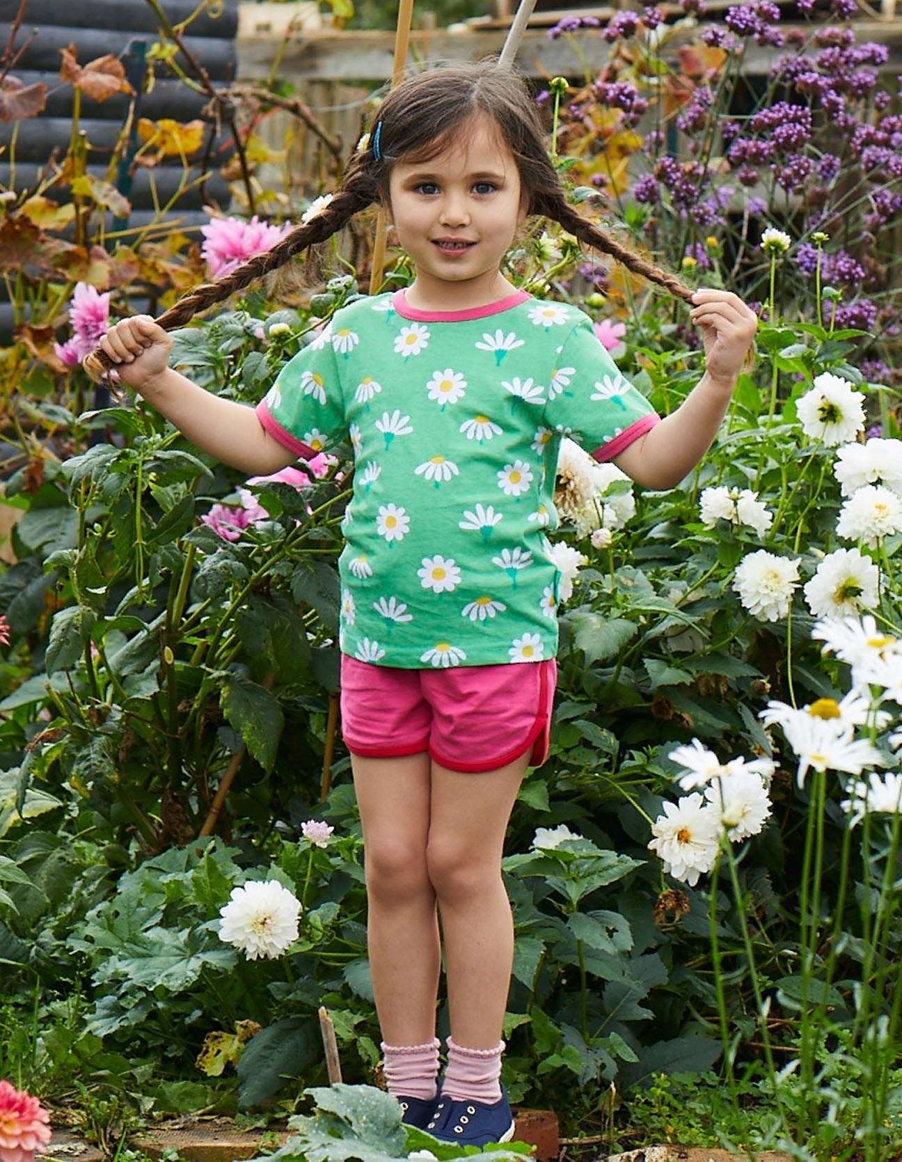 Premium baby daisy print t-shirt, 100% organic cotton, soft pink trim, snap button closure, machine washable, sizes 3-24 months by Toby Tiger at brixbailey.com