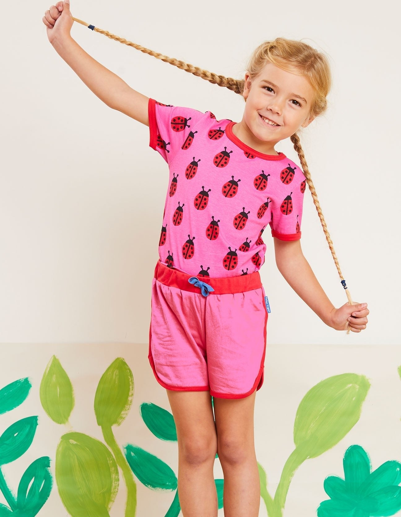 Premium Pink Ladybug Print Baby T-Shirt with Snap Buttons and Red Trim, 100% GOTS Organic Cotton by Toby Tiger at brixbailey.com